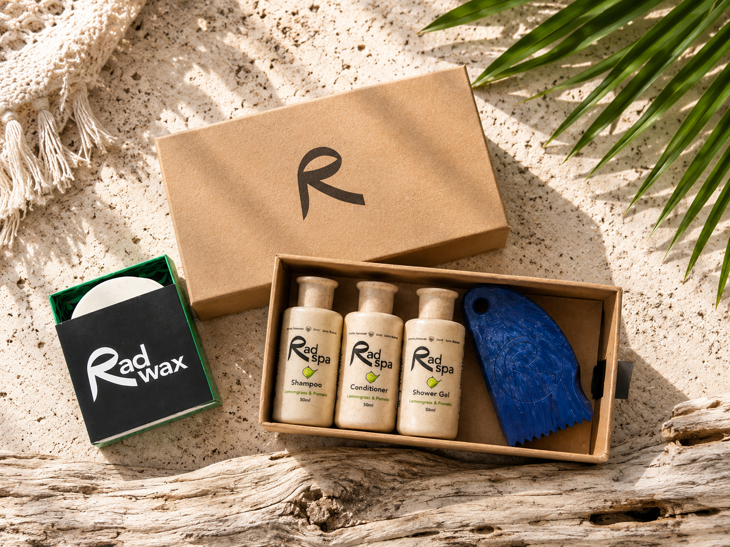 Rad Wax and Rad Spa product set with bottles and a towel on a natural background