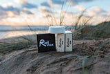 Rad Wax Base Coat products on sand with beach background
