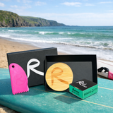Rad Wax Gift Set set on a beach.