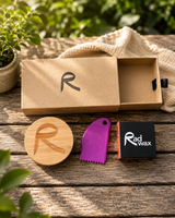 Rad Wax Gift Set including a bamboo keep safe tin, wax comb, and bar of Rad Wax on a wooden surface with greenery in the background.