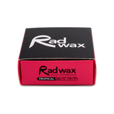 Rad Wax eco surfboard wax, tropical. Packaging with black and red design on a white background