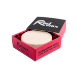 Rad Wax Tropical Eco surf wax in a red box on a white background