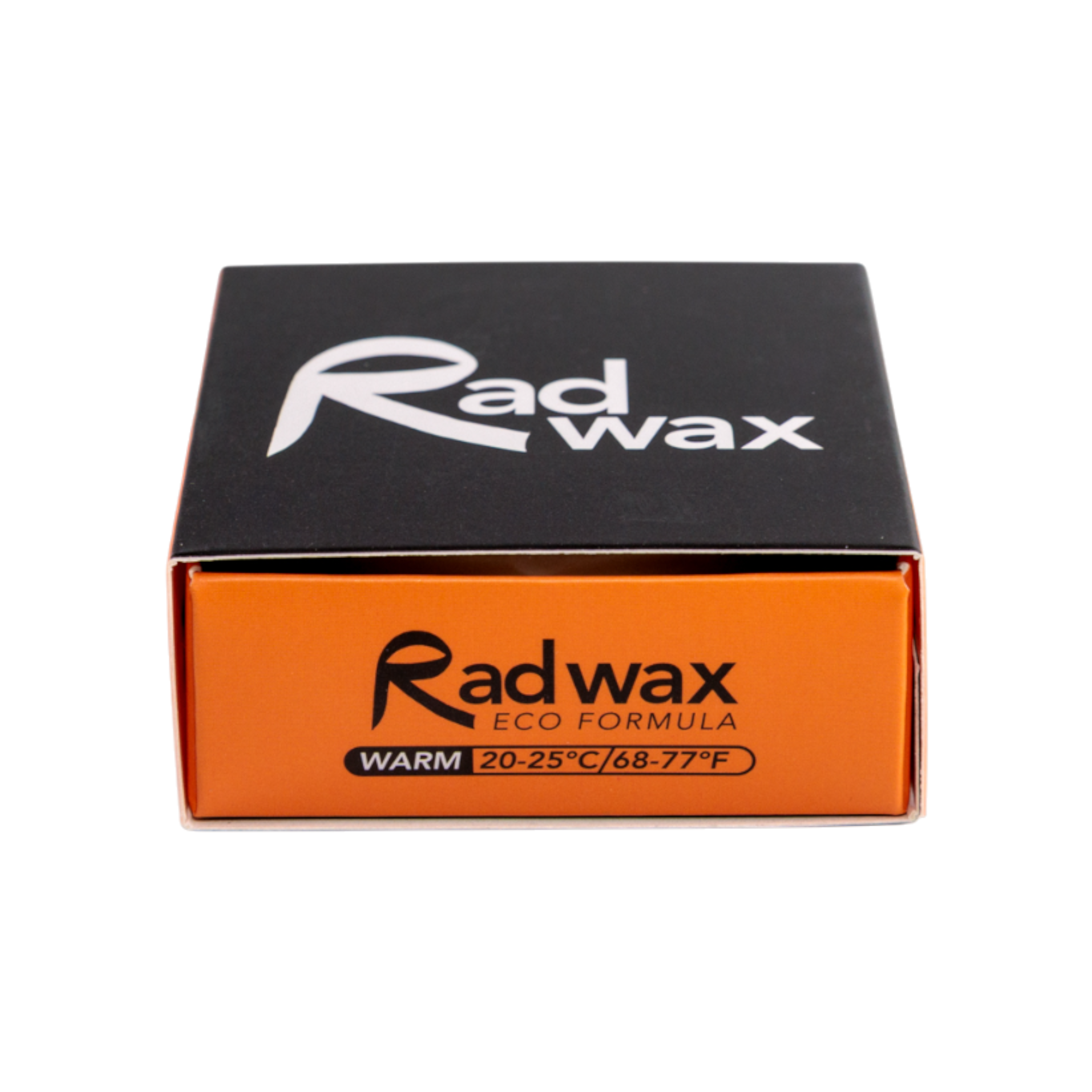 Rad Wax Warm Water eco surfboard wax. Packaging with black and orange design on a white background