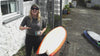 Surfer shows how to apply Rad Wax to surfboard